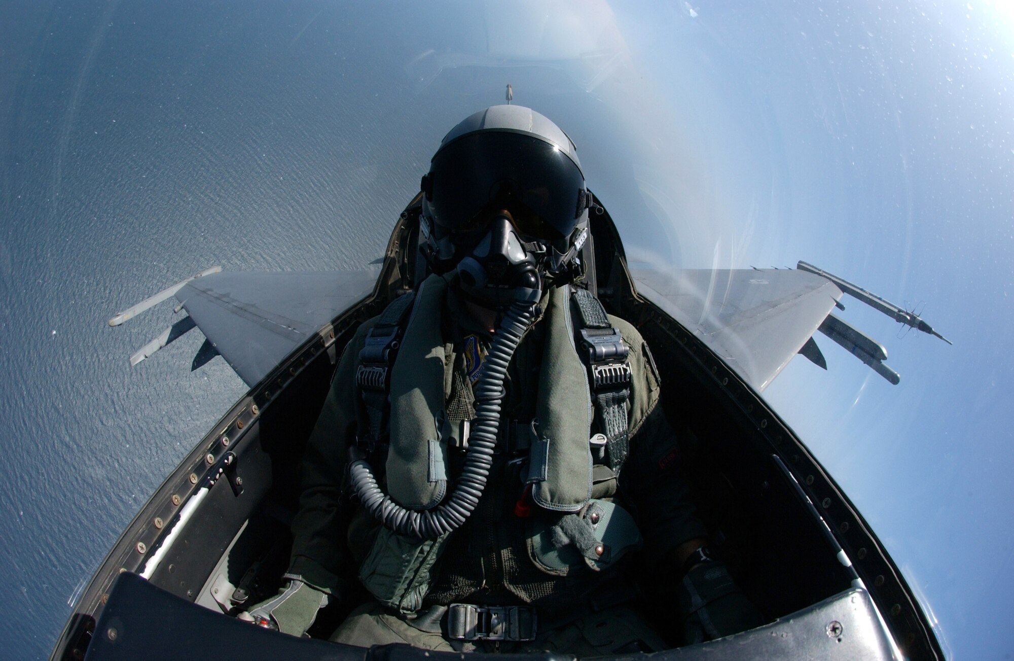 An F-16 Fighting Falcon searches for boats off the coast of South Korea during an AIM-9 missile live-fire exercise Aug. 18. Before firing missiles, planes sweep the range area for boats. The F-16 is assigned to the 80th Fighter Squadron at Kunsan Air Base, South Korea. (U.S. Air Force photo/Tech. Sgt. Jeffrey Allen)