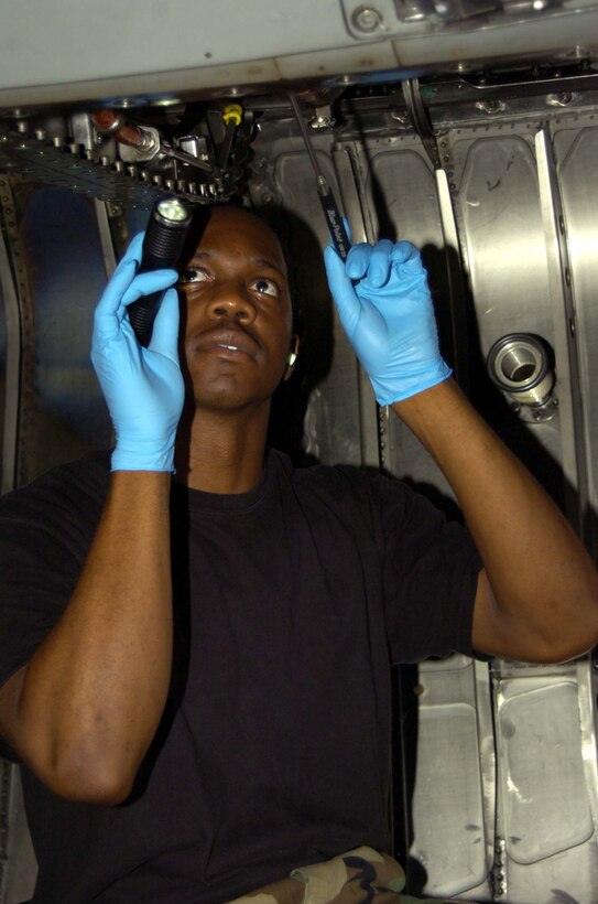 EGLIN AIFORCE BASE, Fla. -- Senior Airmen Joshua Prosper, 33rd Maintenance Squadron jet engine mechanic, inspects for missing nut plates in the engine bay on an F-15C Eagle July 25 in the 33rd MXS Phase Docks. (U.S. Air Force photo/Staff Sgt. Phillip Butterfield)