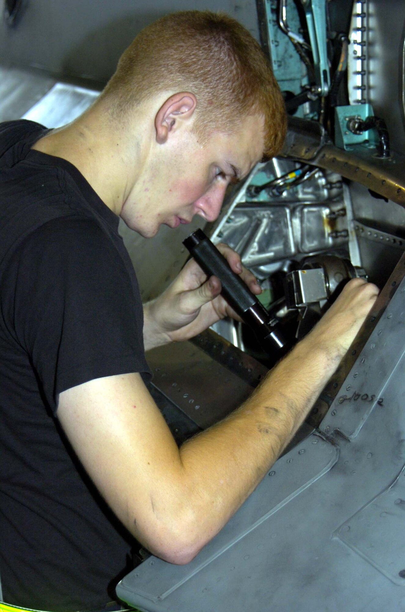 EGLIN AIR FORCE BASE, Fla. -- Airman 1st Class Joseph Lutz, 33rd Maintenance Squadron phase inspection technician, searches for any possible foriegn object damage in an F-15C Eagle hydraulic bay during a 200-hour phase inspection July 25 in the 33rd MXS Phase Dock. (U.S. Air Force photo/Staff Sgt. Phillip Butterfield)