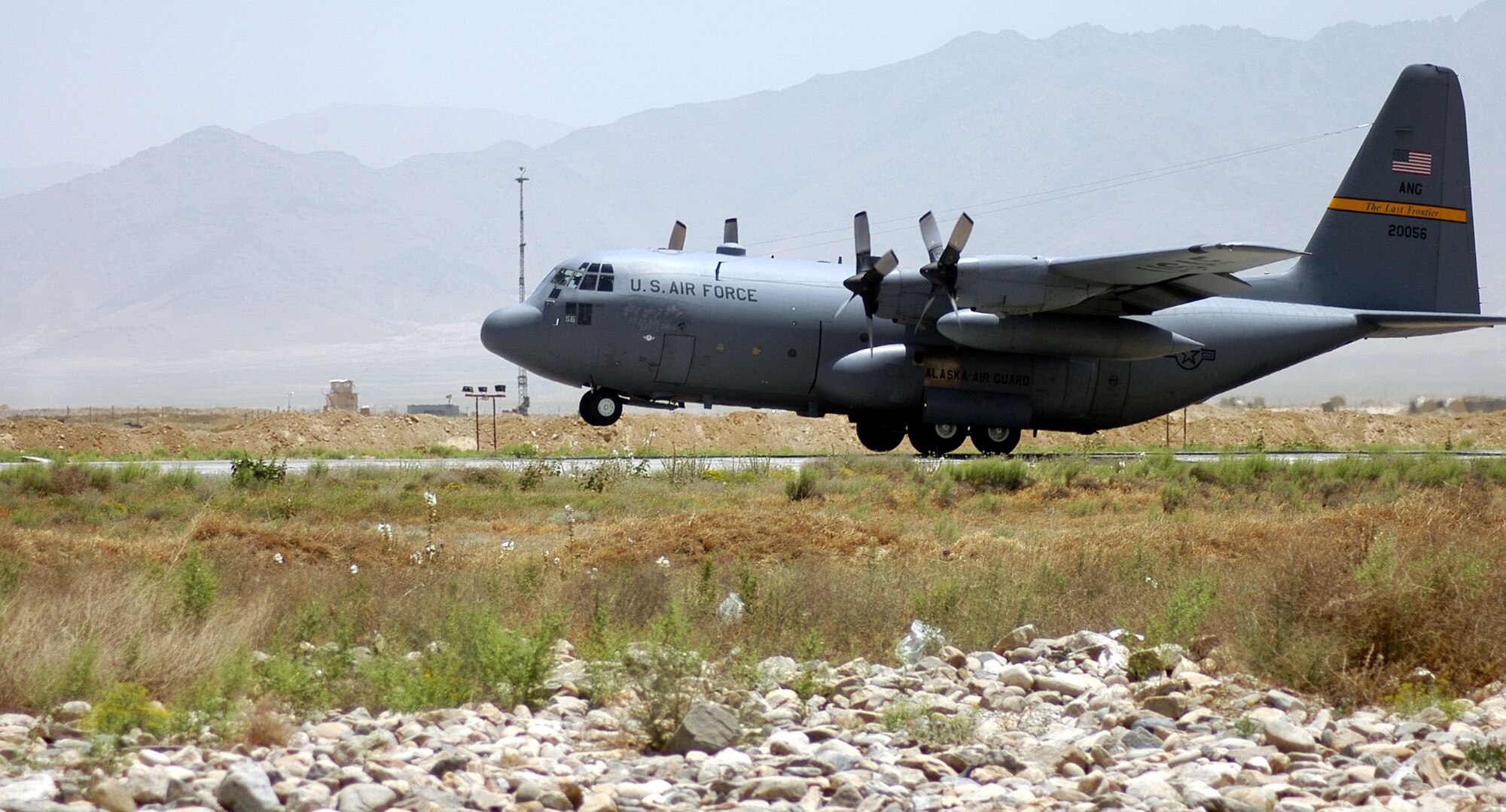 A C-130 Hercules transport aircraft from the Alaska Air National Guard's 144th Airlift Squadron takes off from Bagram Airfield, Afghanistan, this summer. An aircrew from Alaska air-dropped ammunition to U.S. Army Soldiers on the ground Aug. 10 who were in the middle of an engagement against anti-Coalition extremists.  (US Air Force photo/Maj. David Kurle)