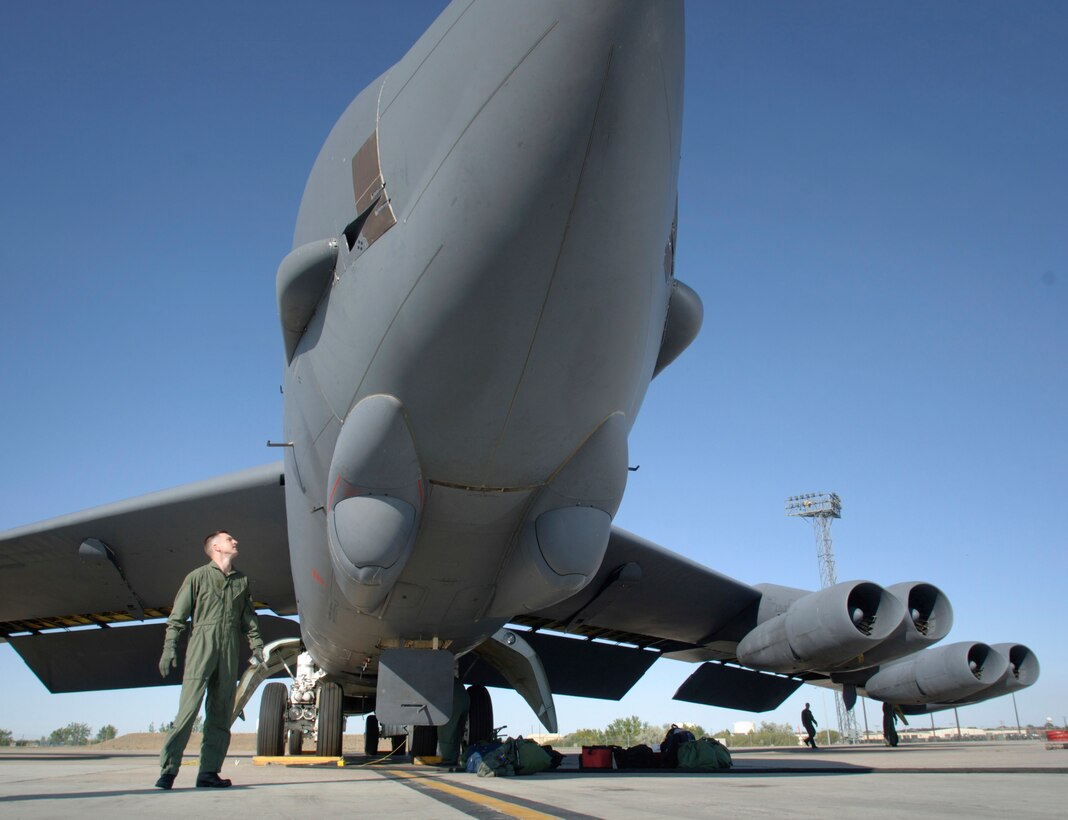 Capt. Patrick Hook performs a walk-around inspection of a B-52 Stratofortress bomber Aug. 22 at Minot Air Force Base, N.D. Captain Hook, from Muskegon, Mich., is with the 23rd Bomb Squadron. (U.S. Air Force photo/Master Sgt. Lance Cheung)
