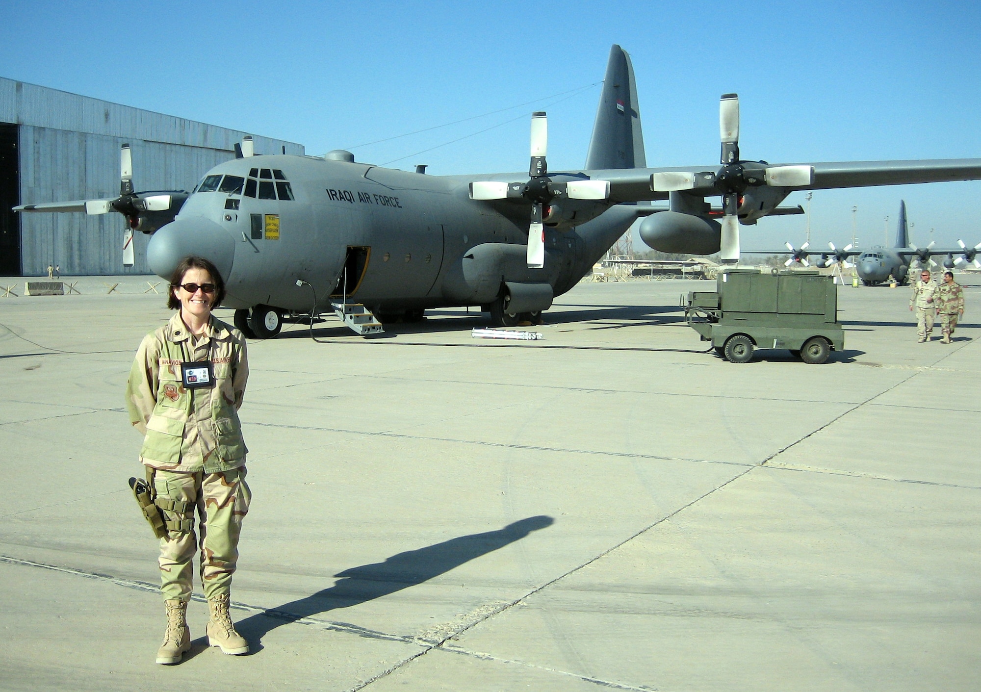 Lt. Col. Moe Banavige, 934th Maintenance Squadron commander, stands by the Iraqi Air Force C-130 that previously belonged to the 934th.