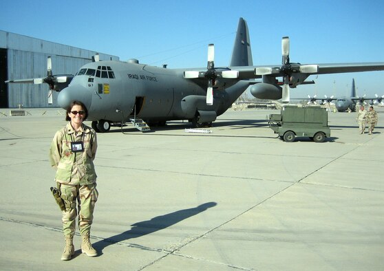 Lt. Col. Moe Banavige, 934th Maintenance Squadron commander, stands by the Iraqi Air Force C-130 that previously belonged to the 934th.