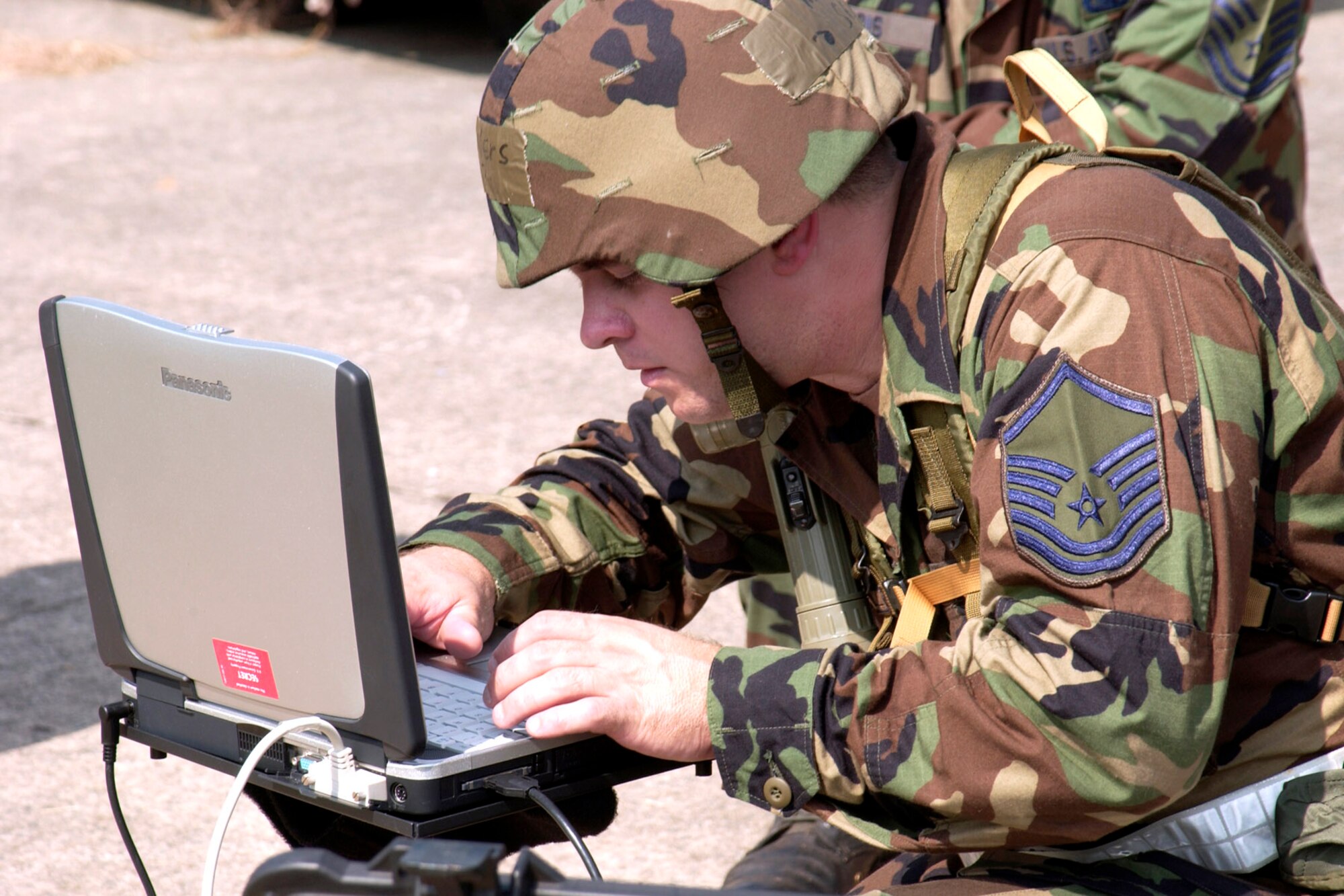Master Sgt. Scott Sellers is evaluated on the set-up and successful operation of a mobile radio satellite phone Aug. 19. The one-hour timed scenario requires Airmen to successfully call-back and send data to "home station" in both non-secure and secure modes. Members of the 240th Combat Communications Squadron are undergoing an operational readiness inspection that evaluates their ability to process people and equipment. (U.S. Air Force photo/Senior Master Sgt. Edward E. Snyder) 
