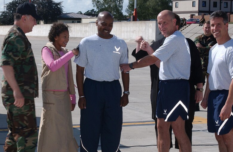 Tech. Sgt. Ronald Dunbar, 435th Medical Group, was STEP promoted to master sergeant by General Hobbins and Col. Kurt Lohide, 435th Air Base Wing commander, prior to the wing run.