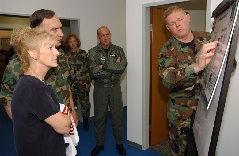 Senior Master Sgt. Mark Pechman, 435th Communications Squadron, briefs Gen. Tom Hobbins, U.S. Air Forces in Europe commander, during a tour of postal operations at the Northside Post Office Aug. 18.