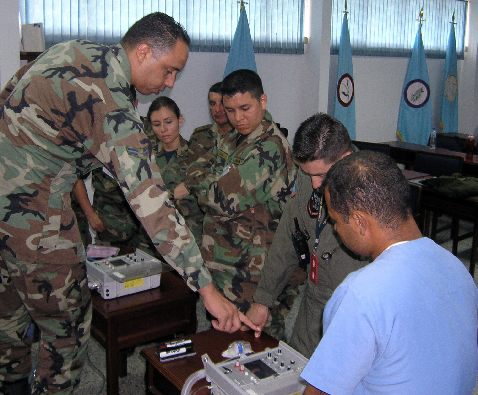 Airman 1st Class Edgardo Sanchez de Jesus instructs participants on the functions of the an impact transport ventilator during an International Aeromedical Evacuation Critical Care Transport Course held in Colombia Aug. 15. Airman Sanchez de Jesus is a cardiopulmonary technician with the 759th Surgical Operations Squadron at Lackland Air Force Base, Texas. (U.S. Air Force photo/Master Sgt. Marcus Vigil)   