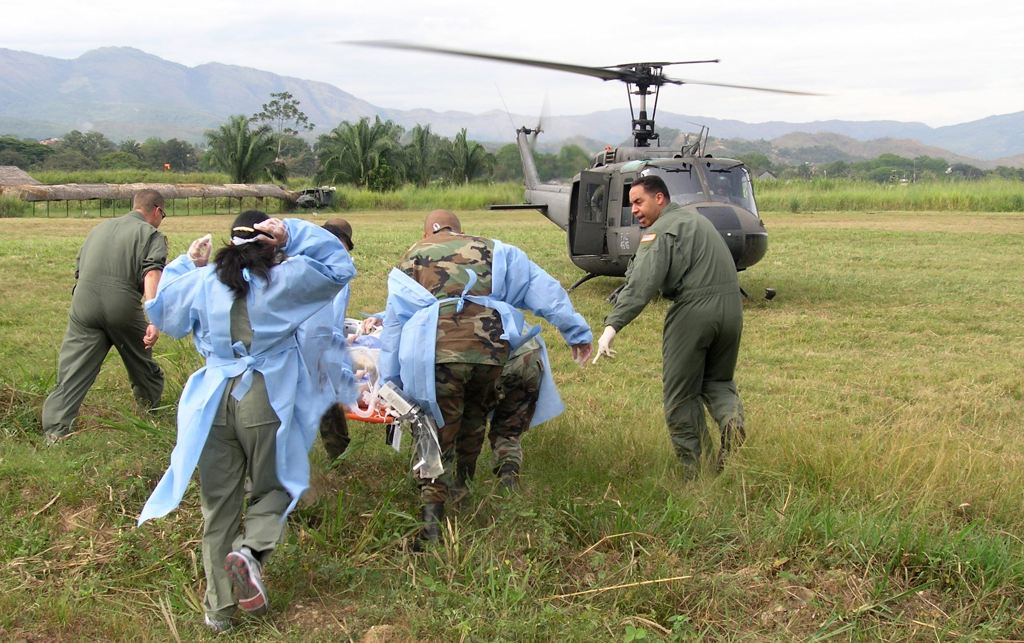 Airman 1st Class Edgardo Sanchez de Jesus instructs students on how to safely approach a helicopter for patient transport during an International Aeromedical Evacuation Critical Care Transport Course in Colombia Aug. 15. Airman Sanchez de Jesus is a cardiopulmonary technician with the 759th Surgical Operations Squadron at Lackland Air Force Base, Texas. (U.S. Air Force photo/Master Sgt. Marcus Vigil)
   