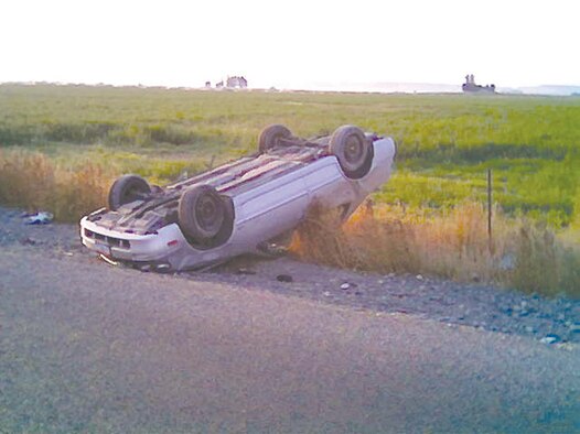 Capt. William Wilkinson, 391st Fighter Squadron, and his father pulled a 19-year-old girl from this car after it flipped four times while heading to C.J. Strike Dam. (Photo by Capt. William Wilkinson)