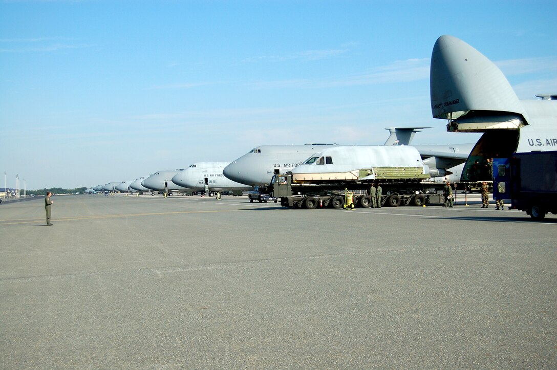 The flight deck from the C-5 Galaxy that crashed April 3 is loaded onto another C-5 at Dover Air Force Base, Del., for transport to Robins Air Force Base, Ga., Aug. 22. The flight deck will be used to as a training simulator. (U.S. Air Force photo/Airman 1st Class James Bolinger)