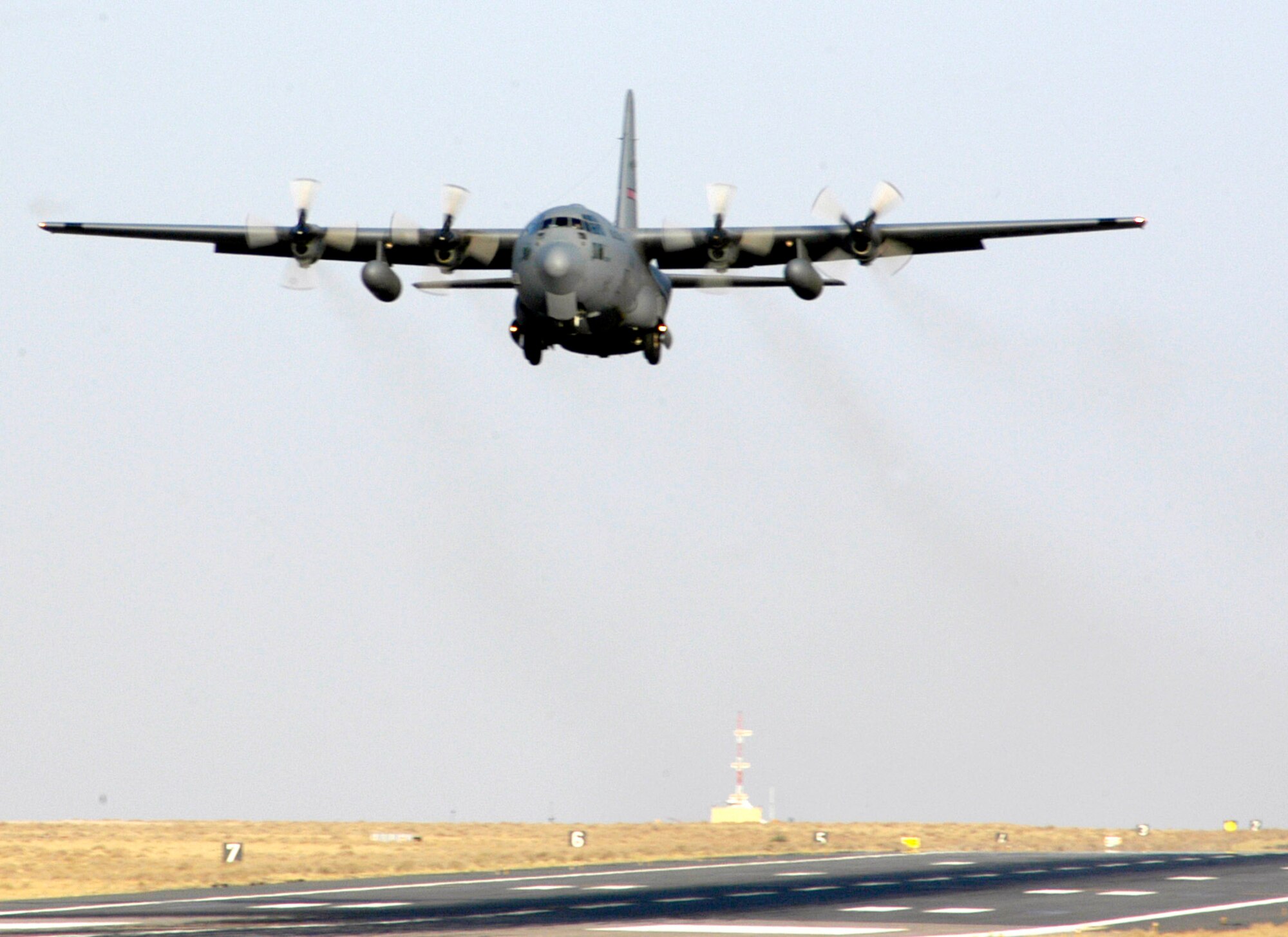A C-130 Hercules from the 386th Air Expeditionary Wing in Southwest Asia takes off on a mission to Iraq. The 386th AEW is the primary aerial hub for Operation Iraqi Freedom and provides airlift support for Operation Enduring Freedom and the Horn of Africa. The wing is comprised of more than 3,400 active-duty, Guard and Reserve Airmen. (U.S. Air Force photo/Staff Sgt. Ryan Hansen)

