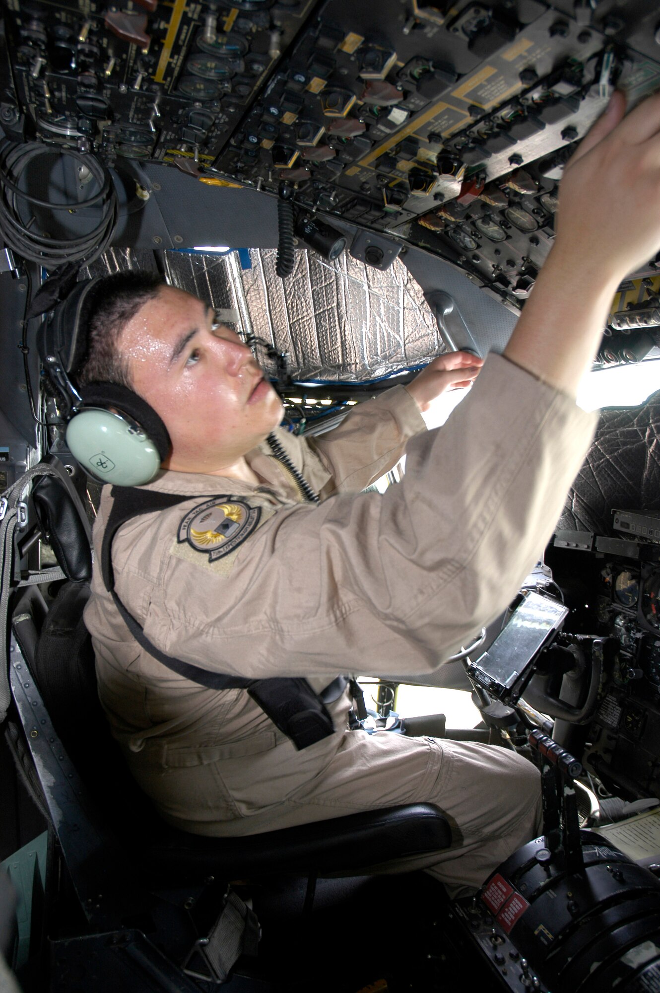 Staff Sgt. Patrick Bowling performs pre-flight checks at a forward operating base in Southwest Asia Aug. 23. Sergeant Bowling is a flight engineer with the 738th Expeditionary Airlift Squadron, which is part of the 386th Air Expeditionary Wing. The wing is the primary aerial hub for Operation Iraqi Freedom and provides airlift support for Operation Enduring Freedom and the Horn of Africa. (U.S. Air Force photo/Staff Sgt. Ryan Hansen) 
