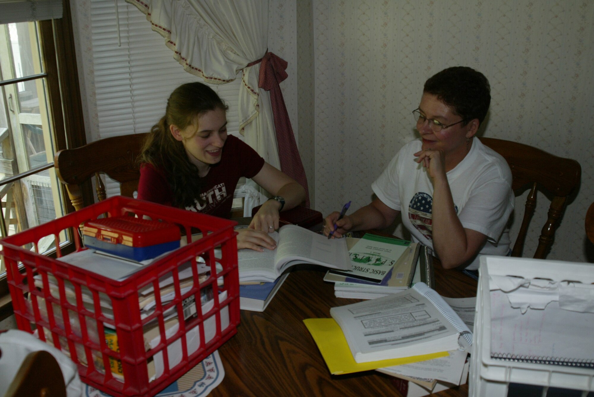 Terri Davis and her daughter Rebecca go through last year's curriculum to get organized for Rebecca's upcoming senior year, her last being homeschooled. Rebecca is in the process of choosing a college to attend after graduation next year.