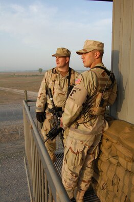 MANAS AIR BASE, Kyrgyzstan -- Staff Sgt. David Hoy and Senior Airman Jacob Medina, 376th Expeditionary Security Forces Squadron, survey the installation perimeter while deployed to Manas Air Base, Kyrgyzstan. (Air Force photo by Master Sgt. Joe Davis)