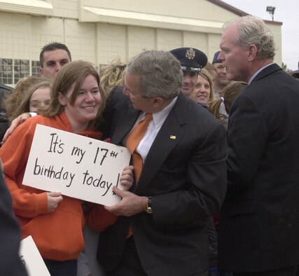 VANCE AIR FORCE BASE, Okla. -- President George W. Bush congratulates Becky Kriner, daughter of Col. Kevin and Mary Kriner, 71st Operations Group commander, on her 17th birthday, while the president visited Vance Air Force Base May 6.  (Air Force photo by Staff Sgt. Amanda Savannah) 