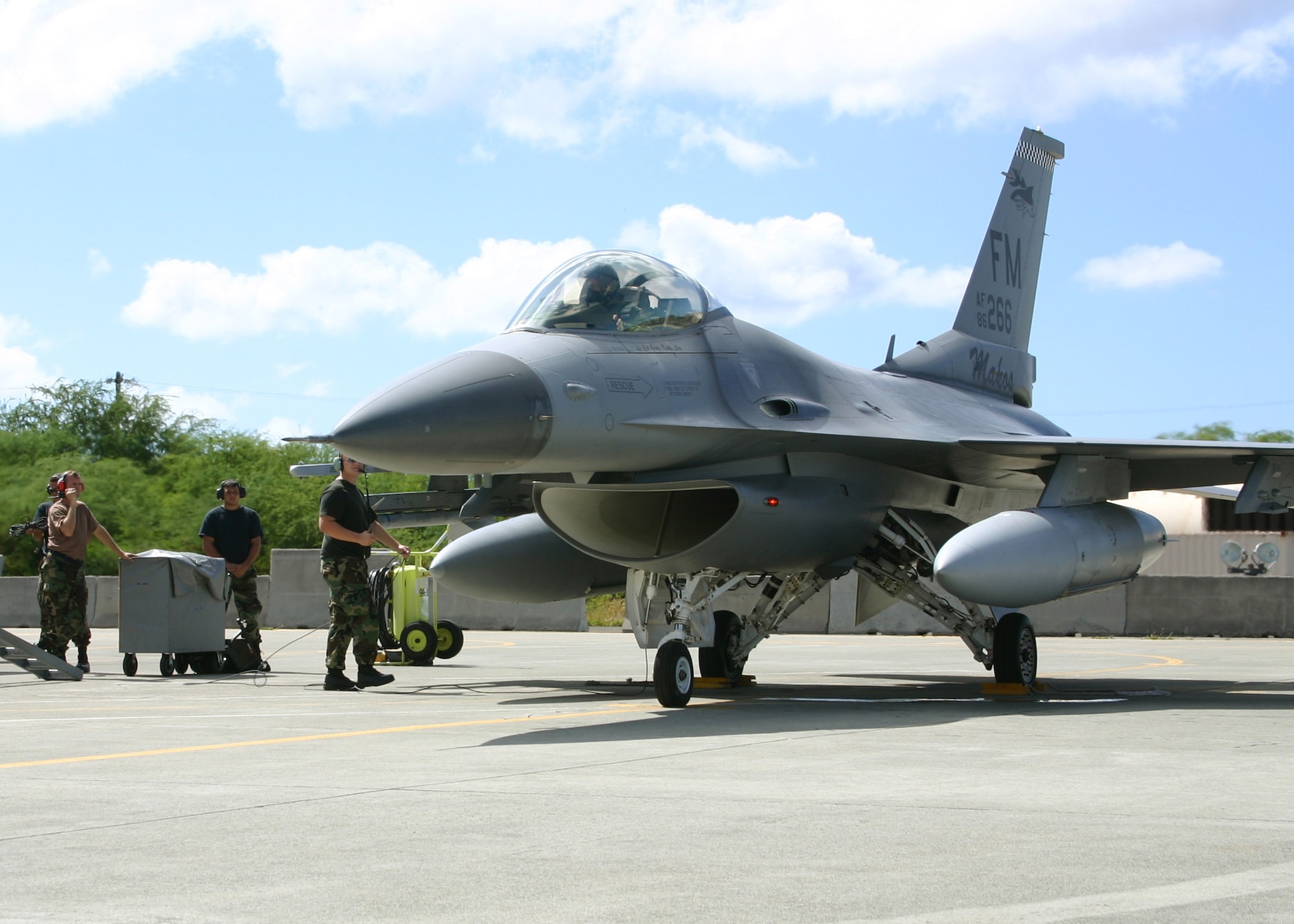 An F-16 from the 482nd Fighter Wing, Homestead Air Reserve Base, Fla. taxis for takeoff Aug. 17 at Hickam Air Force Base, Hawaii. F-16 pilots from Homestead's 93rd Fighter Squadron are conducting Dissimilar Aircraft Combat Tactics training with the Hawaii ANG 199th Fighter Squadron in exercise Cactus Aloha. (US Air Force photo by Master Sgt. Ray Sarracino)
