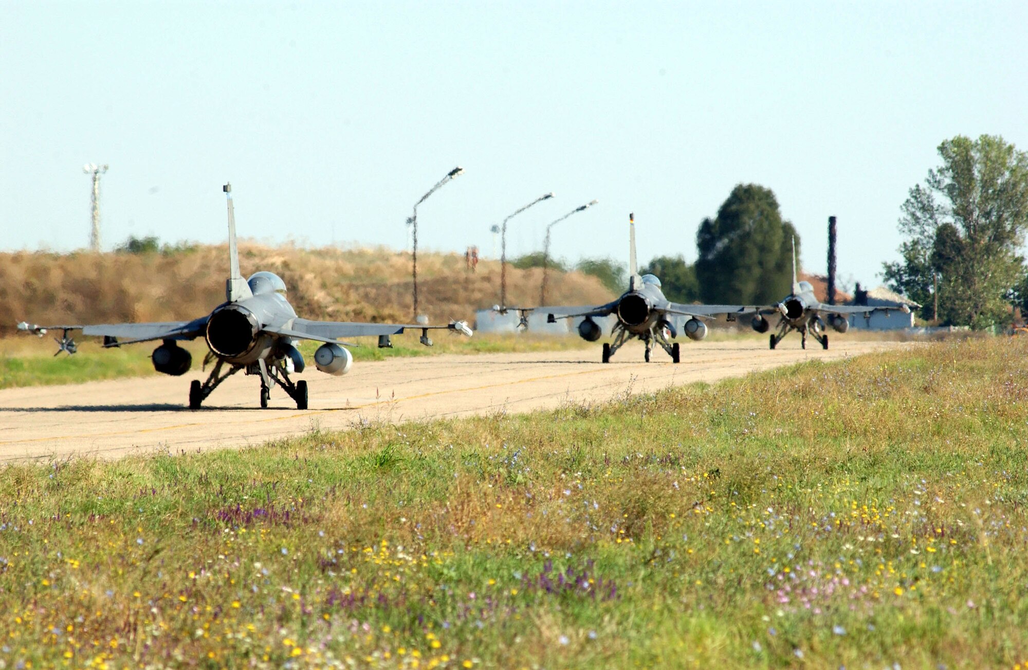 Three F-16 Fighting Falcons taxi for takeoff before the last sortie flown at Mihail Kogalniceanu Air Base, Romania, during Exercise Viper Lance 2006. The exercise, which ran from Aug. 8 to 24, was the first time F-16 crews trained in Romania. (U.S. Air Force photo/Senior Airman Eydie Sakura)

