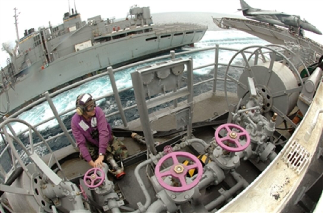 U.S. Navy Airman Josh Faulds stands fuels watch aboard the USS Boxer  during an underway replenishment off the coast of Southern California, Aug. 16, 2006.  The Boxer is  participating in a joint task force exercise while preparing for a Western Pacific deployment.