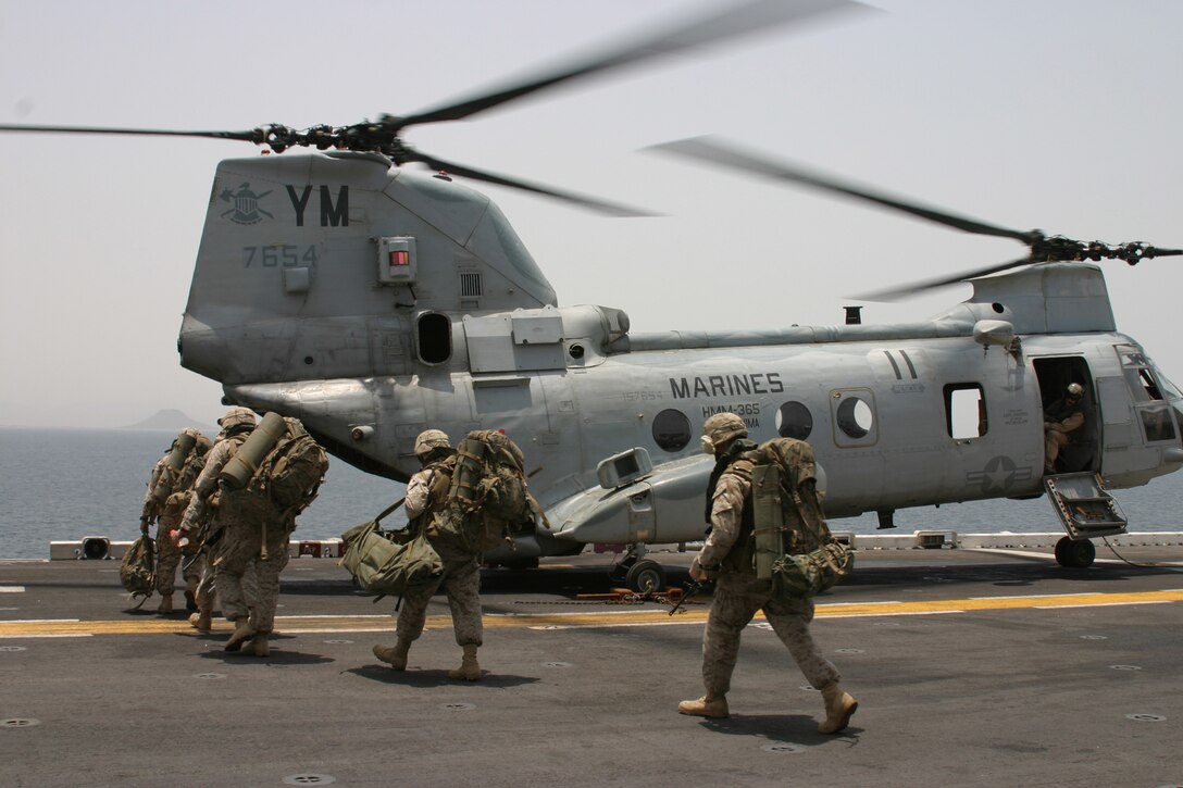 Marines of the 24th Marine Expeditionary Unit prepare to board a CH-46 helicopter on their way to the East African nation of Djibouti Thursday to begin their first training exercise since returning to the Central Command area of operations.::n::The Marines, members of Battalion Landing Team 1st Battalion, 8th Marines, 24th MEU, will spend the next several days firing an array of weapons aboard desert training ranges.