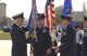 Gen. William R. Looney III, (left), commander, Air Education and Training Command, presents the 2nd Air Force guidon to Maj. Gen. Michael Gould, 2nd AF commander, as Chief Master Sgt. Joseph Barron, 2nd AF command chief master sergeant, watches on during the change of command ceremony at Keesler Air Force Base, Miss., Nov. 9. (U.S. Air Force photo) 