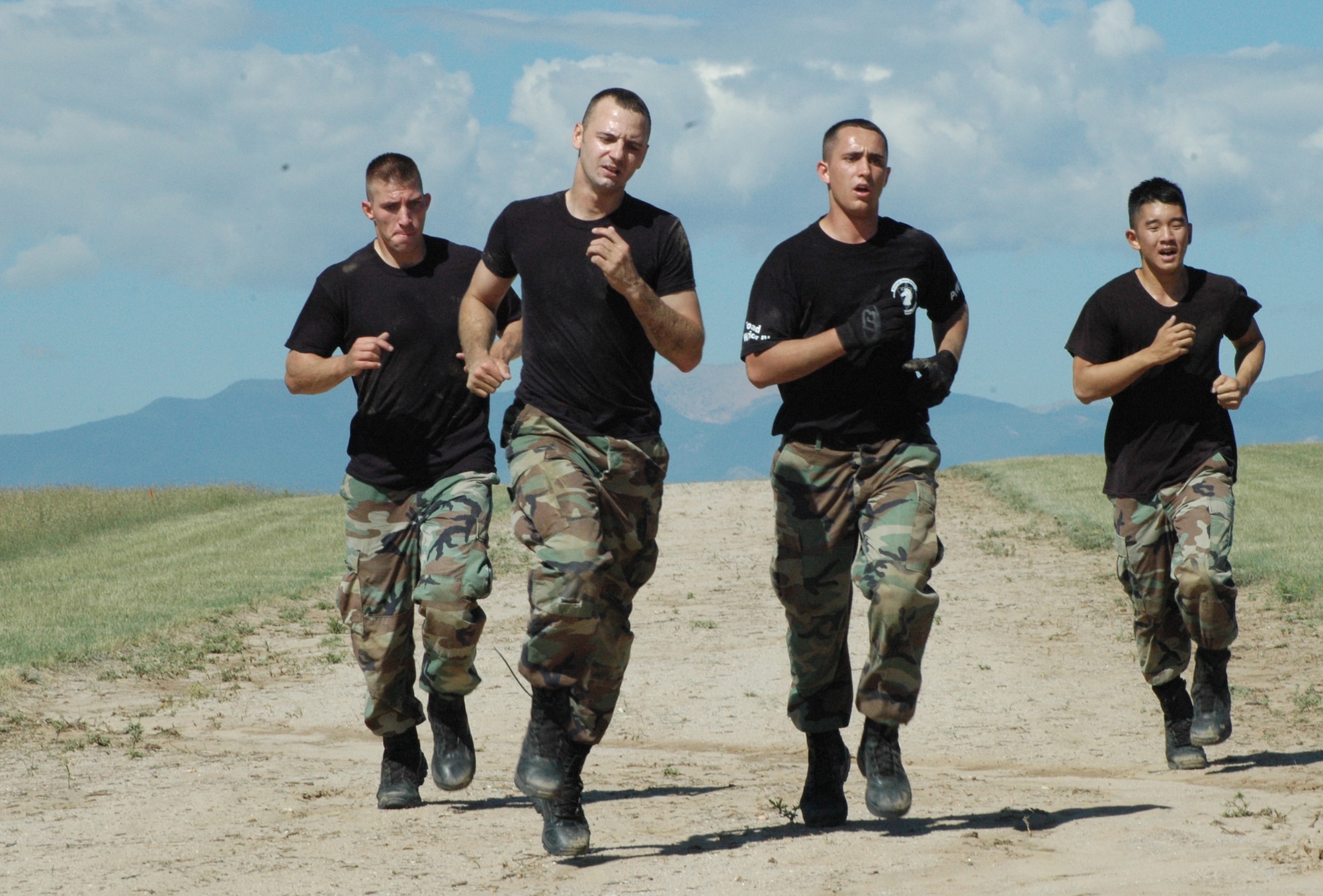 MINOT AIR FORCE BASE, N.D. -- (from left to right) Senior Airman James Rowin, Staff Sgt. Jesse Guerra, Senior Airman Will Benson and Airman 1st Class Tom Donahue, all from the 91st Security Forces Group, run as they close in on the finish line on the obstacle course at Shriever Air Force Base, Colo. on the last day of competition during Guardian Challenge. (U.S. Air Force photo by Senior Airman Danny Monahan)