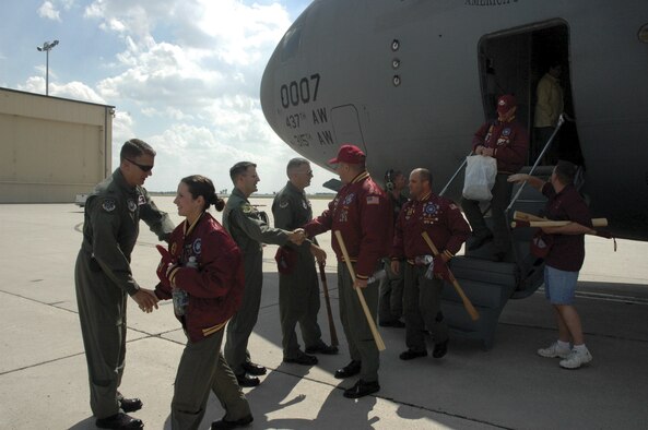 MINOT AIR FORCE BASE, N.D. -- Members of the Team Minot Guardian Challenge team are greeted by (left to right) Col. Greg Tims, 91st Operations Group commander, Col. Paul Bell, 5th Bomb Wing vice commander,  and Col. Marty Whelan, 91st Space Wing commander, as they step off a C-17  here Saturday after the week-long competition in Colorado Springs, Colo. (U.S. Air Force photo by Senior Airman Danny Monahan)