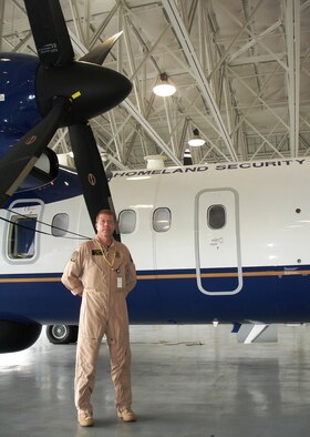 John Beutlich, Director of Air Operations for the Customs and Border Protection’s Miami Air and Marine Branch, stands with a new DASH-8 200Q Maritime Patrol aircraft at Homestead Air Reserve Base, Fla.  Mr. Beutlich assumed command of the Homestead-based Customs operations June 11, and the DASH-8 aircraft arrived soon after (Air Force photo by Jake Shaw)
