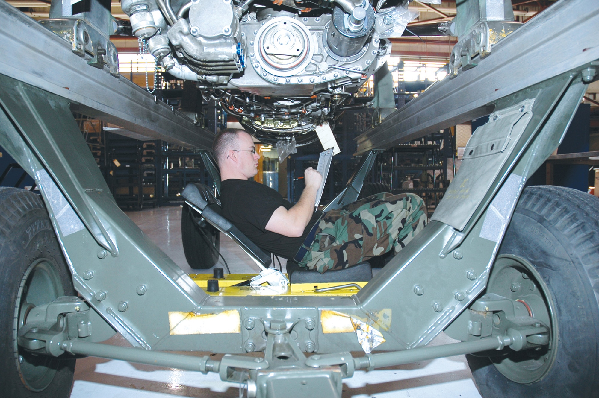 TYNDALL AIR FORCE BASE, Fla. (AETCNS) -- Staff Sgt. Michael Kimionakis, 325th Maintenance Squadron jet engine propulsion craftsman, completes a post test cell inspection on an F-15 engine recently. The inspection must be completed twice -- once to find the write-ups, and then again to make sure the write-ups were corrected. (U.S. Air Force photo by Staff Sgt. Benjamin Rojek)