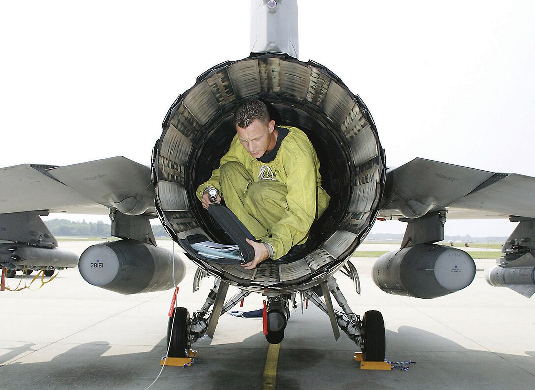 Staff Sgt. Edgar Lewis, 55th Aircraft Maintenance Unit crew chief, completes an inspection on exhaust flap seals on an F-16 at Shaw Air Force Base, S.C. (U.S. Air Force photo/Senior Airman Holly MacDonald)