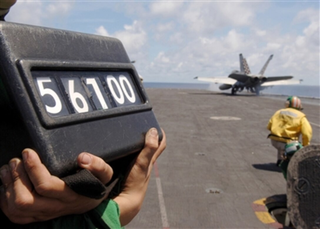 The weight of an F/A-18F Super Hornet assigned to the "Checkmates" of Strike Fighter Squadron 211 is displayed as it is launched from the flight deck of the nuclear-powered aircraft carrier USS Enterprise in the Indian Ocean, Aug. 22, 2006. The Enterprise Carrier Strike Group is on a scheduled six-month deployment in support of the global war on terrorism. 