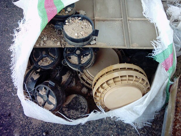 Anti-tank and anti-personnel mines were among the hundreds of weapons, munitions and improvised explosive-making materials captured by Marines from TOW Platoon, 2nd Tank Battalion, attached to Team Gator, D Company, 2nd Assault Amphibian Battalion, Regimental Combat Team 5.