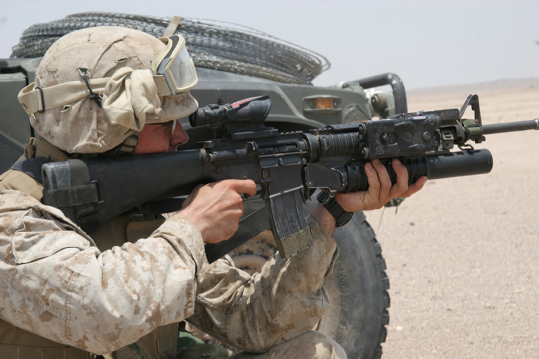 Marines from Alpha Company Battalion Landing Team 1st Battalion 8th Marines, 24th Marine Expeditionary Unit, shoot rounds down range during a Company size assault in Djibouti Africa August 27, 2006. ::n::The 24th MEU has been conducting live fire training in Africa before they enter Pakistan in the near future. (U.S. Marine Corps Photo by Lance Corporal Joshua Lujan) ::n::::n::::n::  ::n::