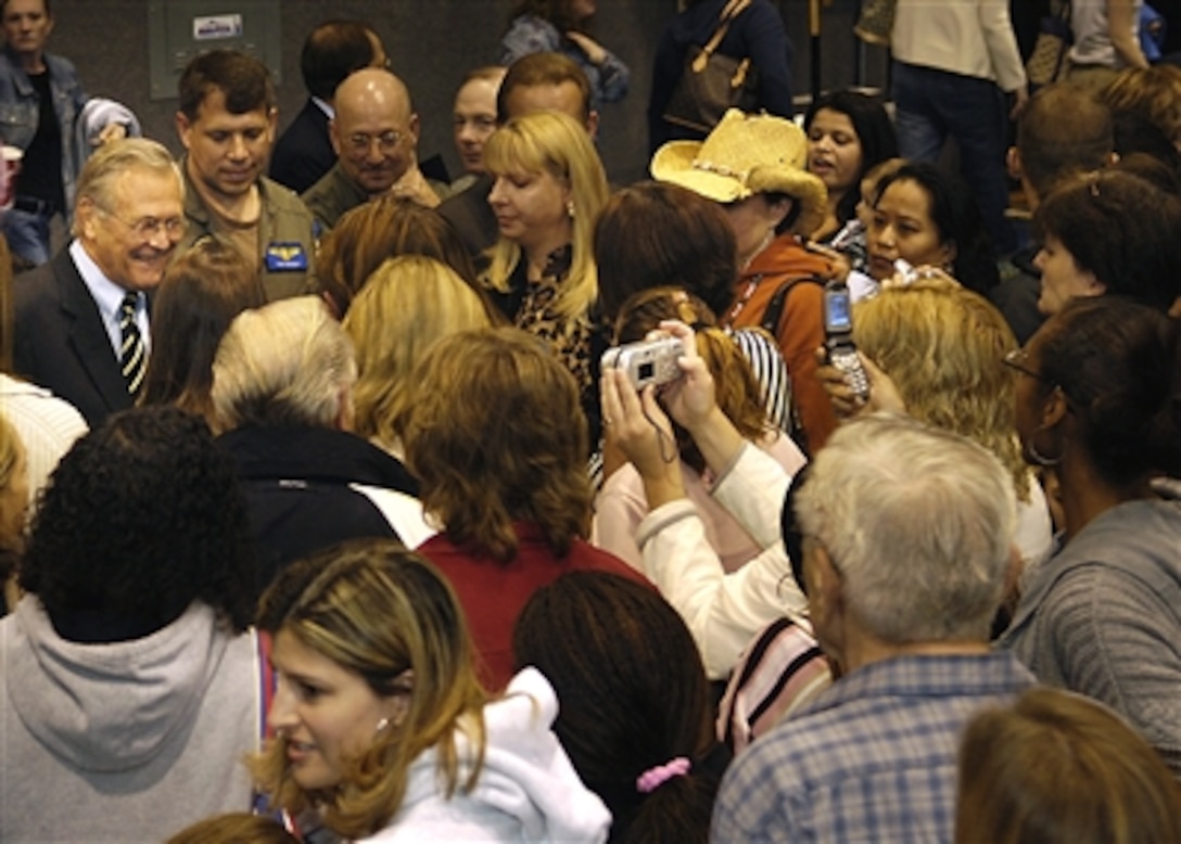 Defense Secretary Donald H. Rumsfeld, left,  meets with approximately 600 family members of U.S. Army soldiers assigned to the 172nd Stryker Brigade Combat Team, which is deployed in support of Operation Iraqi Freedom, on Fort Wainwright, Alaska, Aug. 26, 2006. 