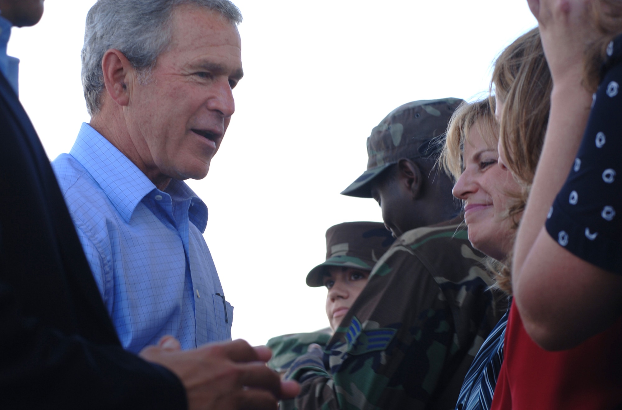 Janet Ladner meets President George W. Bush during a stop at Keesler Air Force Base, Miss., today. The president met Airmen and civilians from Keesler AFB during his visit to the Gulfport region in Mississippi to view the area devastated by Hurricane Katrina one year ago. Ms. Ladner is with the 2nd Air Force. (U.S. Air Force photo/Tech. Sgt. Cecilio Ricardo Jr.) 