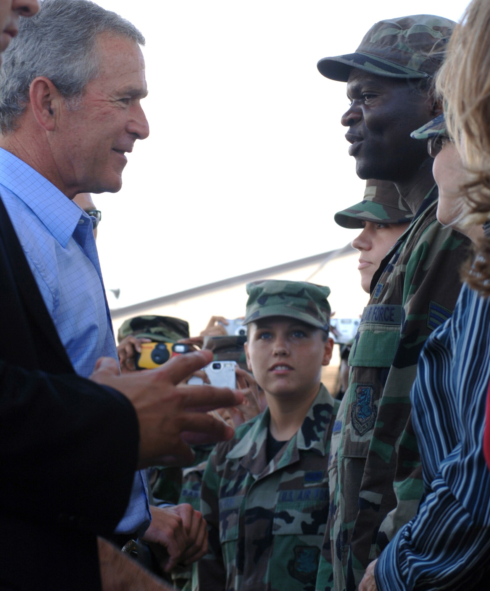 Senior Airman Ngwa Ntumngia talks with President George W. Bush during a stop at Keesler Air Force Base, Miss., today. The president met Airmen and civilians from Keesler AFB during his visit to the Gulfport region in Mississippi to view the area devastated by Hurricane Katrina one year ago. Airman Ntumngia is an administration specialist with the 81st Medical Operations Squadron and originally from Cameroon.(U.S. Air Force photo/Tech. Sgt. Cecilio Ricardo Jr.) 
