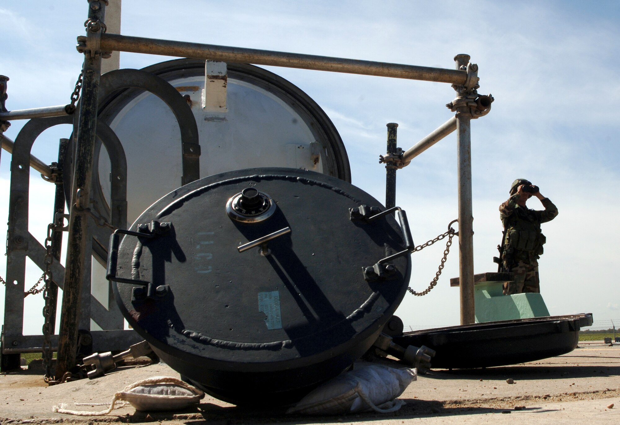 Airman 1st Class Christopher Ramirez observes off-site activities at a Minuteman III intercontinental ballistic missile launch facility during the annual code change Aug. 25. The Airman is a security escort team member with the 791st Missile Security Forces Squadron at Minot Air Force Base, N.D. (U.S. Air Force photo/Airman 1st Class Chris Boitz) 

