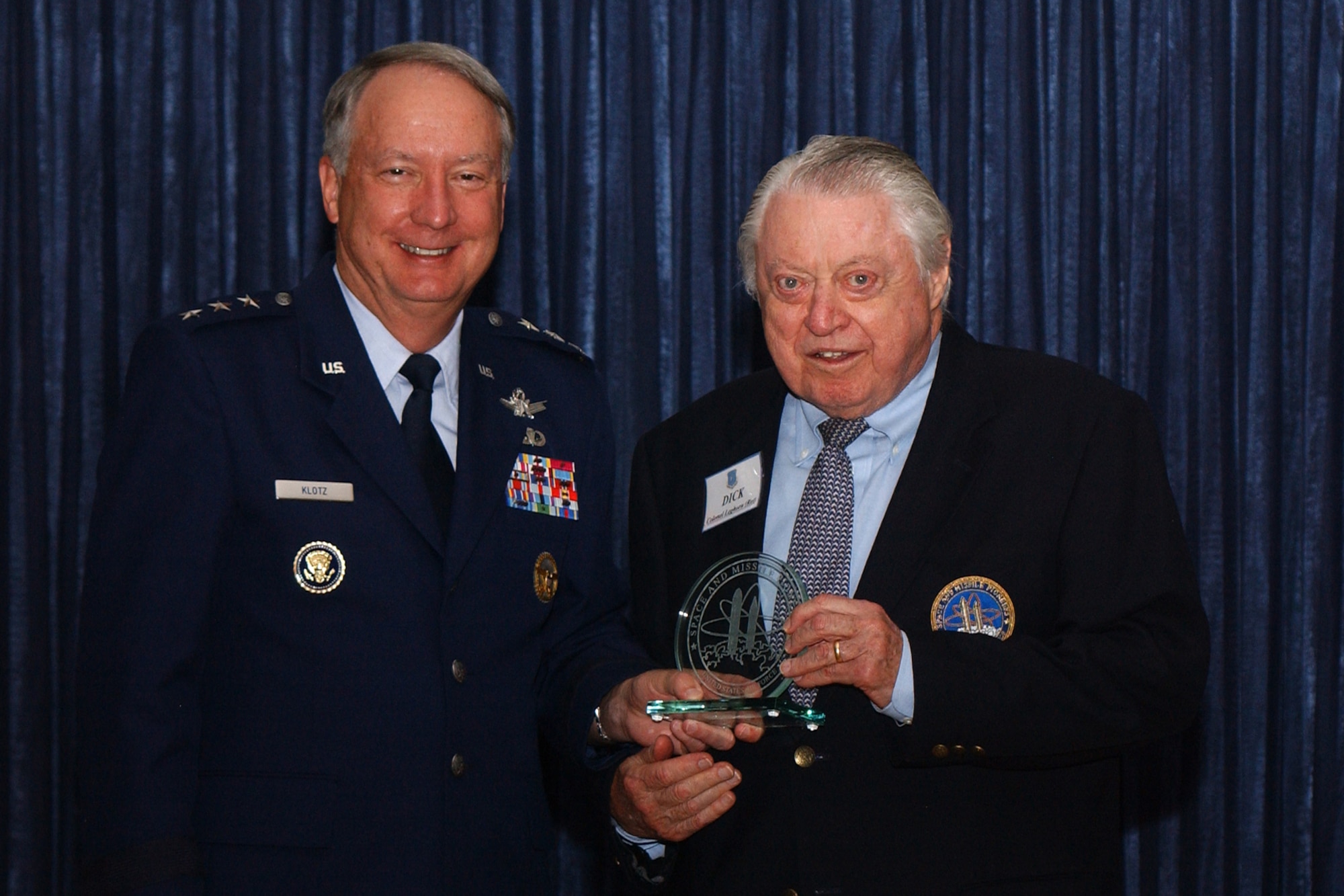 Retired Col. Richard S. Leghorn, Air Force Reserve, accepts his Air Force Space and Missile Pioneers Hall of Fame award Aug. 24 from Lt. Gen. Frank G. Klotz, vice commander, Air Force Space Command, Peterson Air Force Base, Colo. (U.S. Air Force photo by Duncan Wood)                   