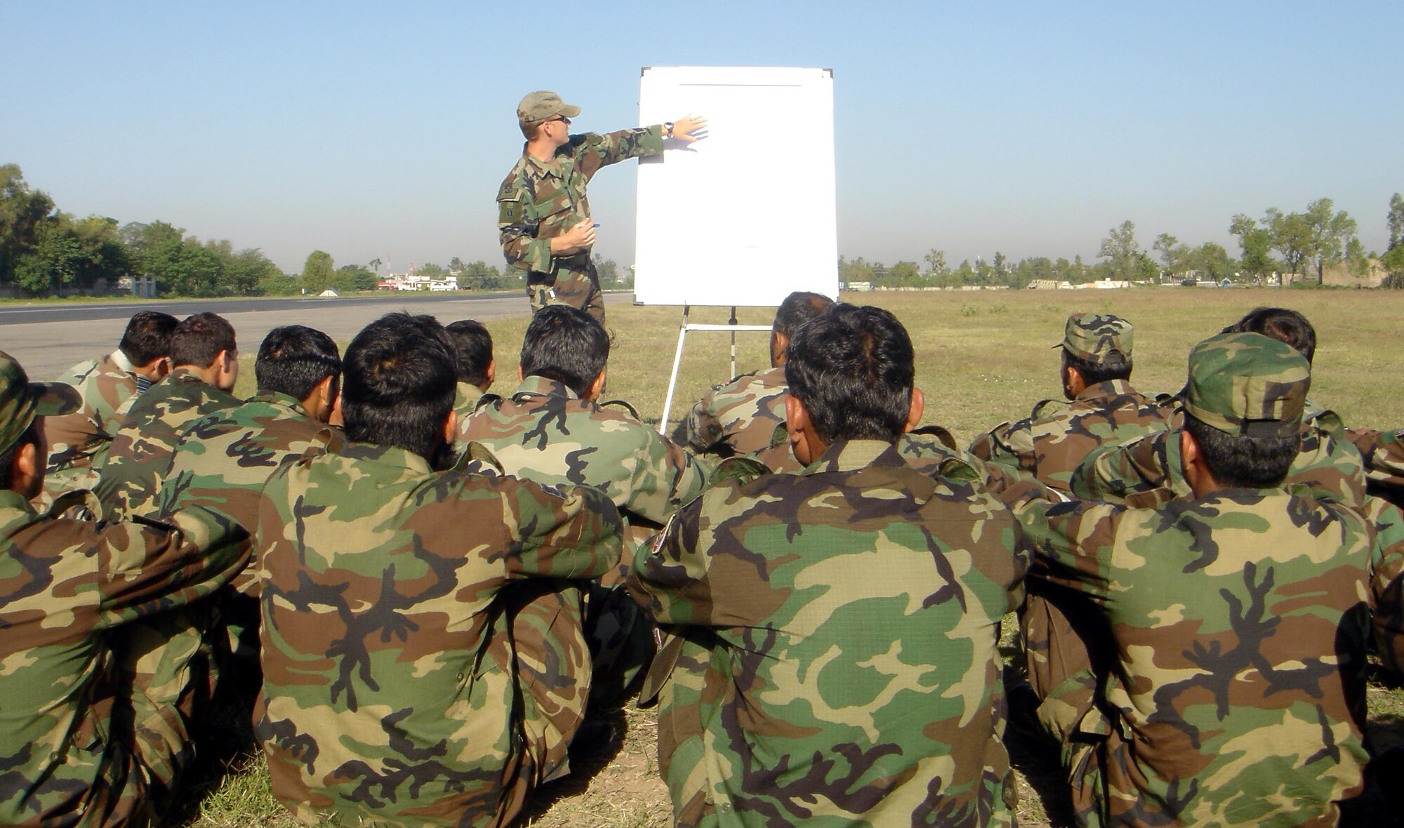 A 6th Special Operations Squadron combat aviation advisor instructs a class on battle field drills in a host nation.  CAAs from the 6th SOS assist aviation forces worldwide. (Courtesy Photograph)