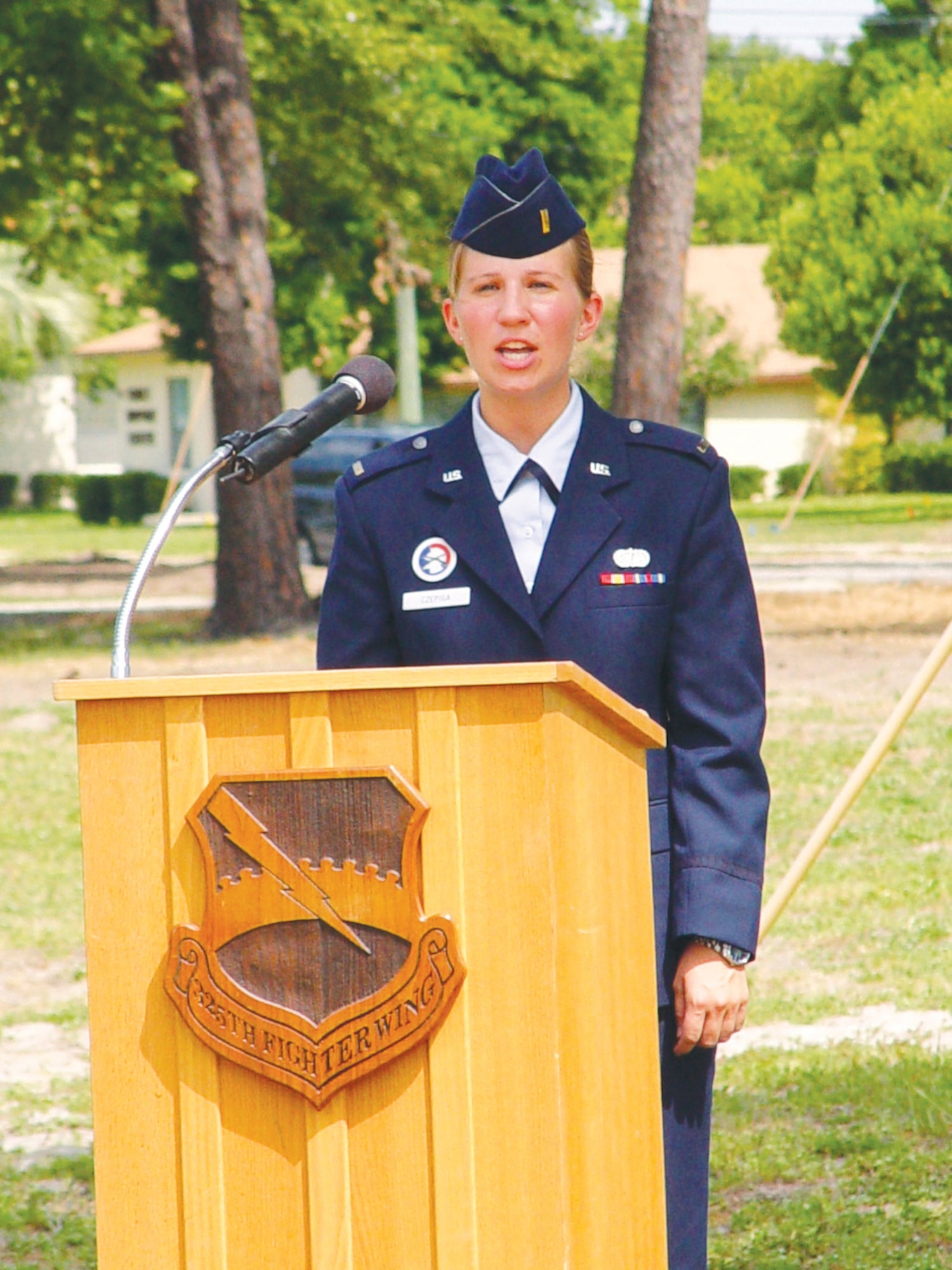 Then 2nd Lt. Carolynn Czepiga, 325th Fighter Wing protocol office, sings the National Anthem during a base event. (U.S. Air Force photo)