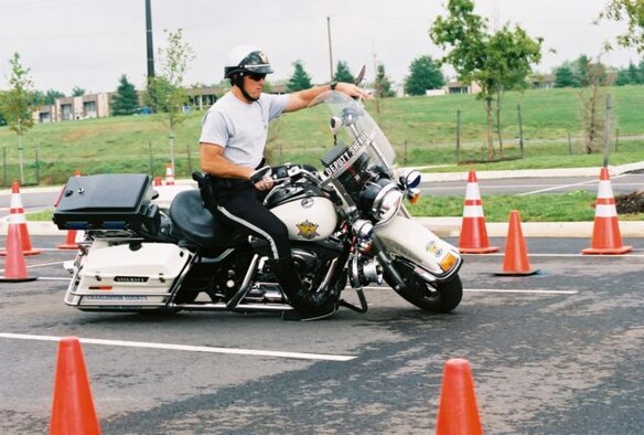 Easy riding: Tech. Sgt. Rob Grimsley, 315th Airlift Wing Family Support, competes during the Second Annual Captial City Challenge police motorcycle skills competition in Tallahassee, Fla. Sergeant Grimsley and his team from the Charleston County Sheriff’s Office took first place in this competition.