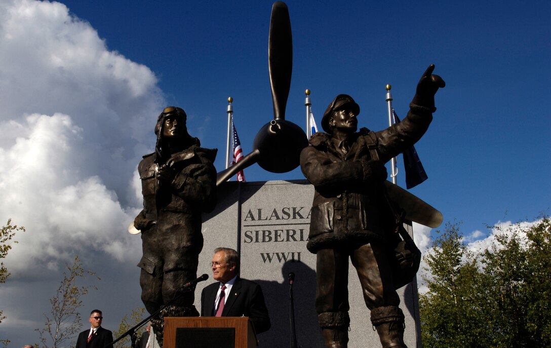 U.S. Defense Secretary Donald H. Rumsfeld speaks in front of the Alaska-Siberia Lend Lease statue dedicated as a memorial to U.S.-Soviet military cooperation during World War II during a ceremony in Fairbanks, Alaska, Aug. 27, 2006. 