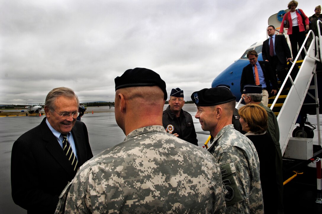 U.S. Defense Secretary Donald H. Rumsfeld and his staff are greeted by the senior military leaders of U.S. forces in Alaska at Fairbanks International Airport, Aug. 26, 2006. While in Alaska, Rumsfeld met with family members of the troops deployed with the 172nd Stryker Brigade Combat Team.
