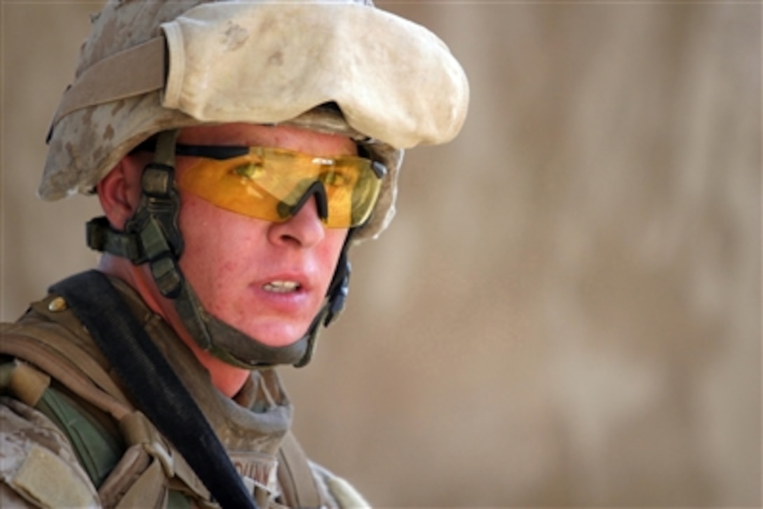 U.S. Marine Corps Sgt. Mike B. Dunn patrols through Haditha, Iraq, on Aug. 11, 2006.  Dunn is attached to India Company, 3rd Battalion, 3rd Marine Regiment, Regimental Combat Team 7, I Marine Expeditionary Force (Forward).  