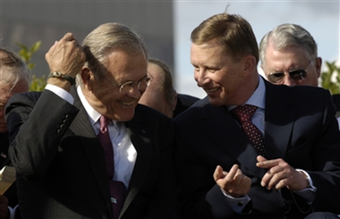 Secretary of Defense Donald H. Rumsfeld shares a lighter moment with Russian Defense Minister Sergei Ivanov during a ceremony in Fairbanks, Alaska, on Aug. 27, 2006.  Rumsfeld and Ivanov are taking part in a dedication ceremony of a memorial to U.S.-Soviet military cooperation during World War II.  