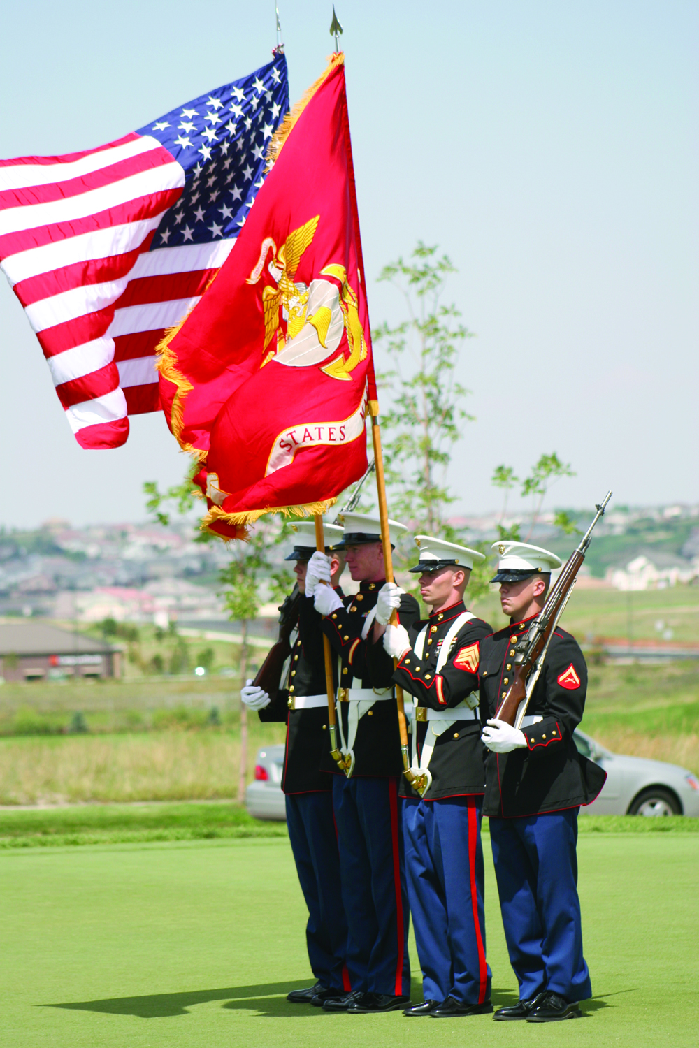 Marines with Marine Air Control Squadron 23 present the colors on top of the putting greens at Heritage Eagle Bend Golf Course in Aurora, Colo. The golf course was host to the Marine Corps Scholarship Foundation's 4th Annual Golf Classic and Fund Drive of Colorado.