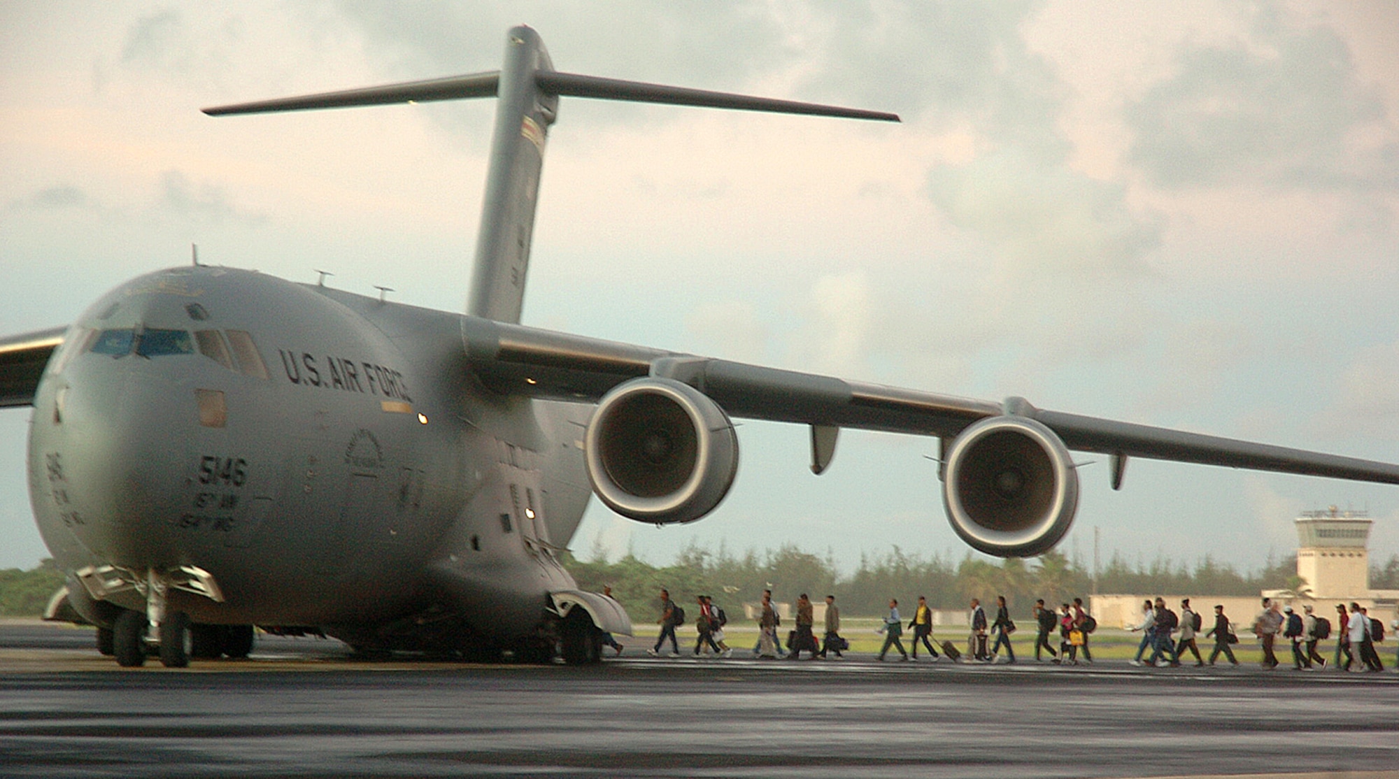 The second wave of 188 Wake Island evacuees board a C-17 Globemaster III, from Hickam Air Force Base, Monday prior to Super Typhoon Ioke reaching the tiny U.S. territory. Ioke is expected to hit the island around 8.p.m. EDT Wednesday. (U.S. Air Force photo/Tech. Sgt. Andrew Leonhard) 
