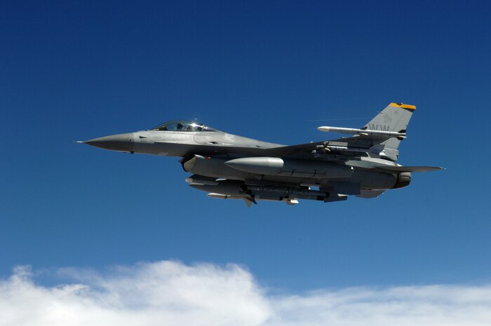 NELLIS AFB, Nev. -- An F-16CJ from Misawa Air Base, Japan, patrols the skies looking for enemy anti-aircraft missile sites during exercise Red Flag Aug. 23. The exercise takes place over the sprawling Nevada test and Training Range, which offers more than 1,600 bombale targets and a fully integrated air defense system that keeps pilots on their toes. The F-16CJ specializes in locating and destroying surface-toair radars and gun and missile sites. (U.S. Air Force photo/Airman 1st Class Andy Dumboski)