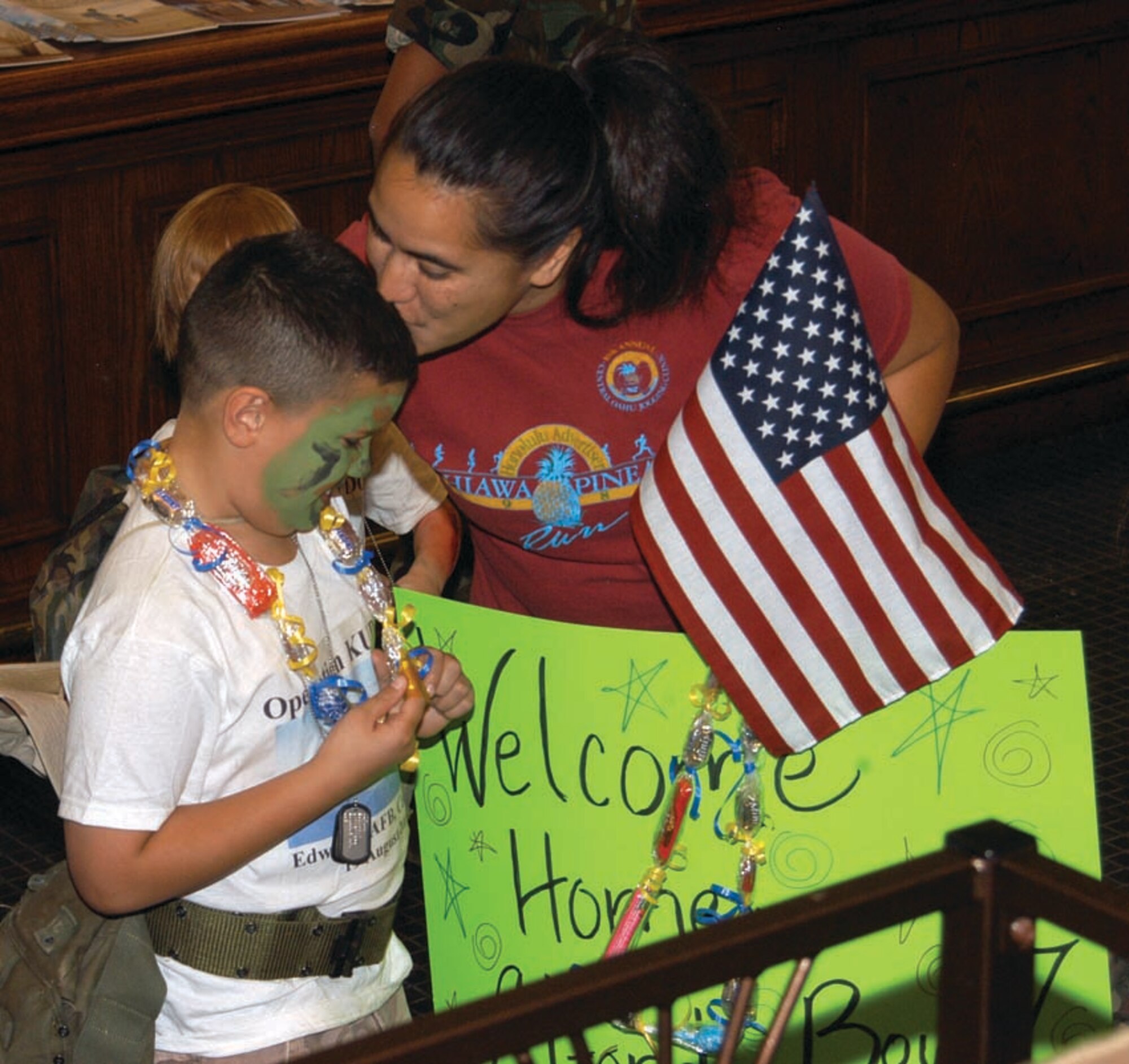 EDWARDS AIR FORCE BASE, Calif. — Seven-year-old Elijah Alford receives a “welcome home” kiss from his mom, Lupe Alford, following Elijah’s mock deployment. (Photo by Airman Stacy Garcia)