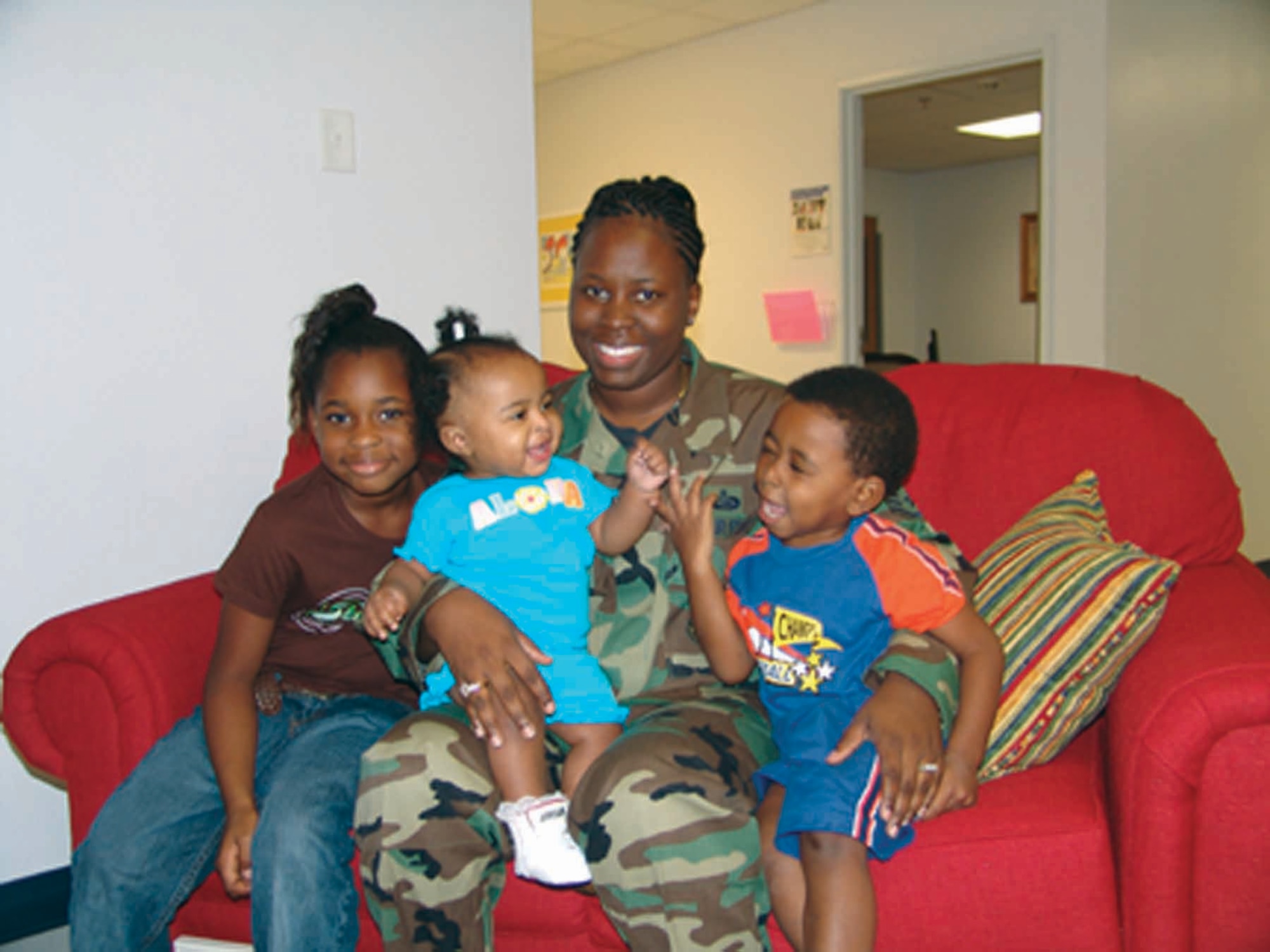 EGLIN AIR FORCE BASE, Fla. — Staff Sgt. Ravin McCray and her children, Kiara, Kayla and Kendall, found a new home here after Hurricane Katrina destroyed their home in Mississippi. (Photo by Lois Walsh)