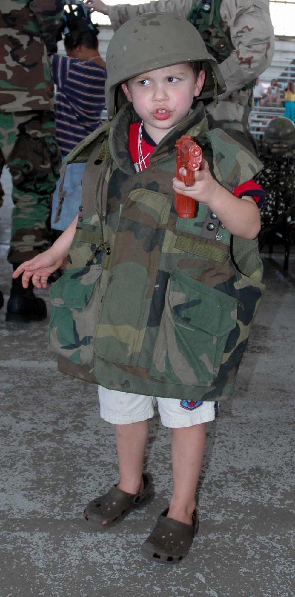 EGLIN AIR FORCE BASE, Fla.  — Four-year-old Dominic Zampogna tries on some protective gear during Operation Hero.  He is the son of deployed 1st Lt. Mark Zampogna, 46th Operations Support Squadron airfield operation officer. (Photo by Maranda Rimes)